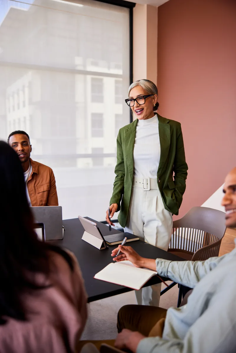 An executive leading a boardroom conversation