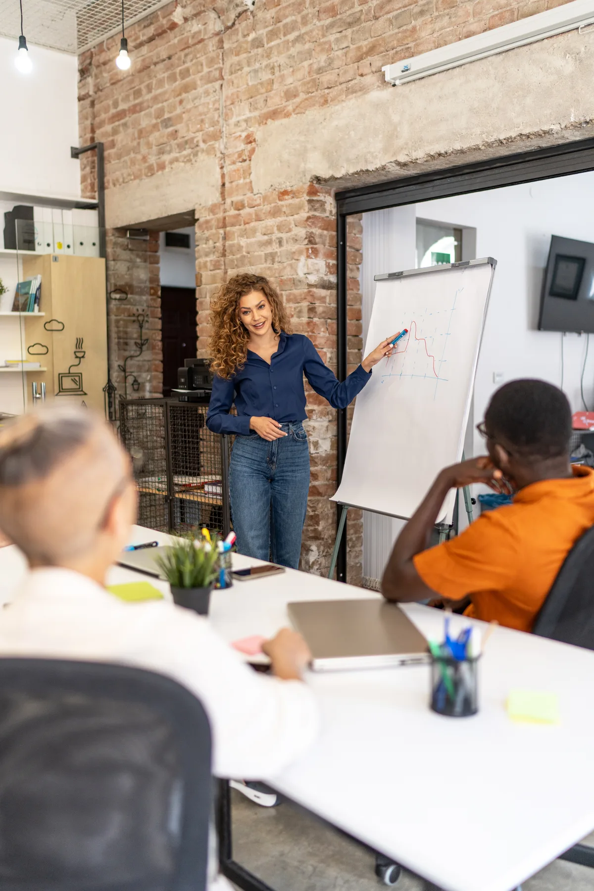 A facilitator leading a warm, engaged workshop